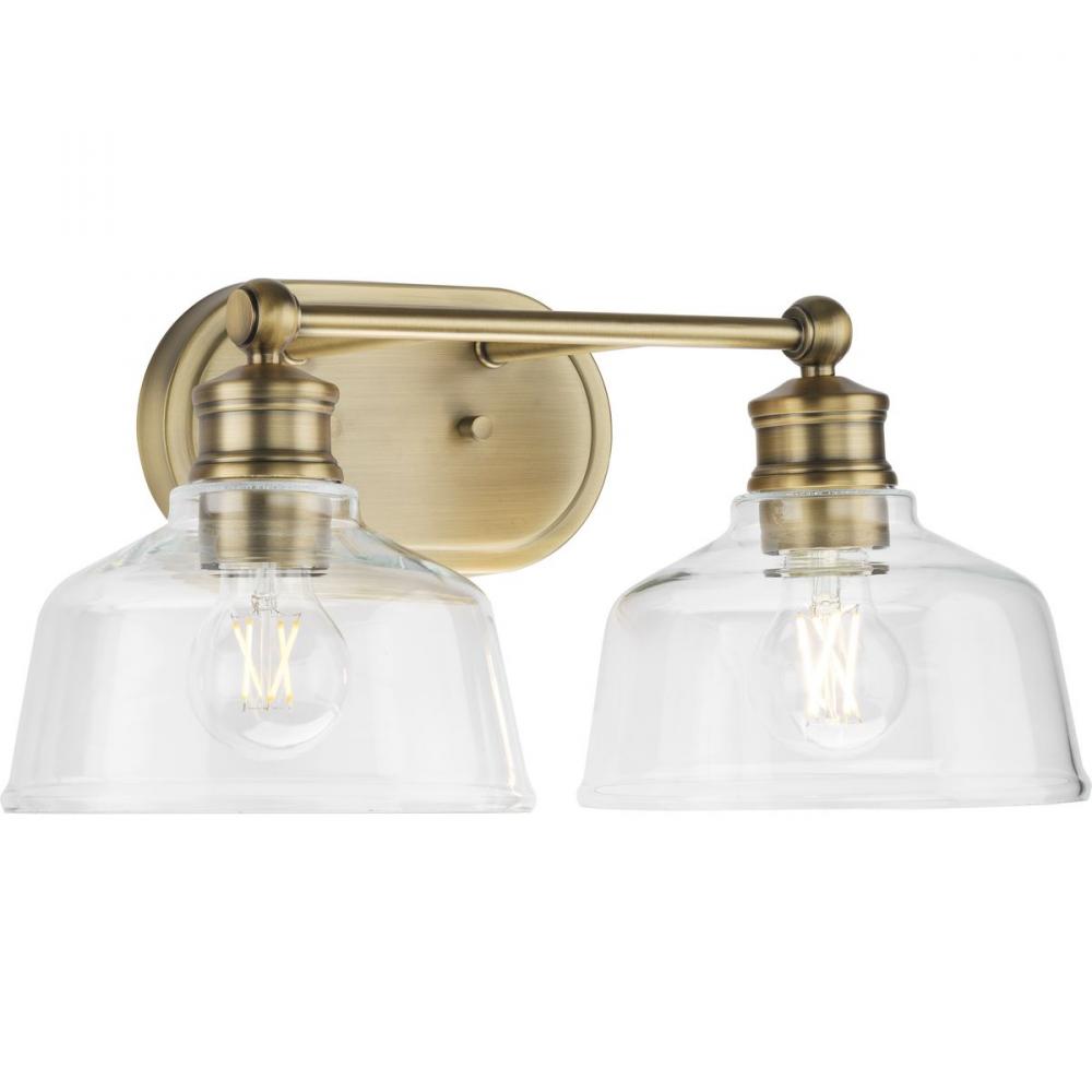 Singleton Collection Two-Light 17&#34; Vintage Brass Farmhouse Vanity Light with Clear Glass Shades